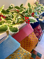 Colourful Christmas Stockings on a fireplace