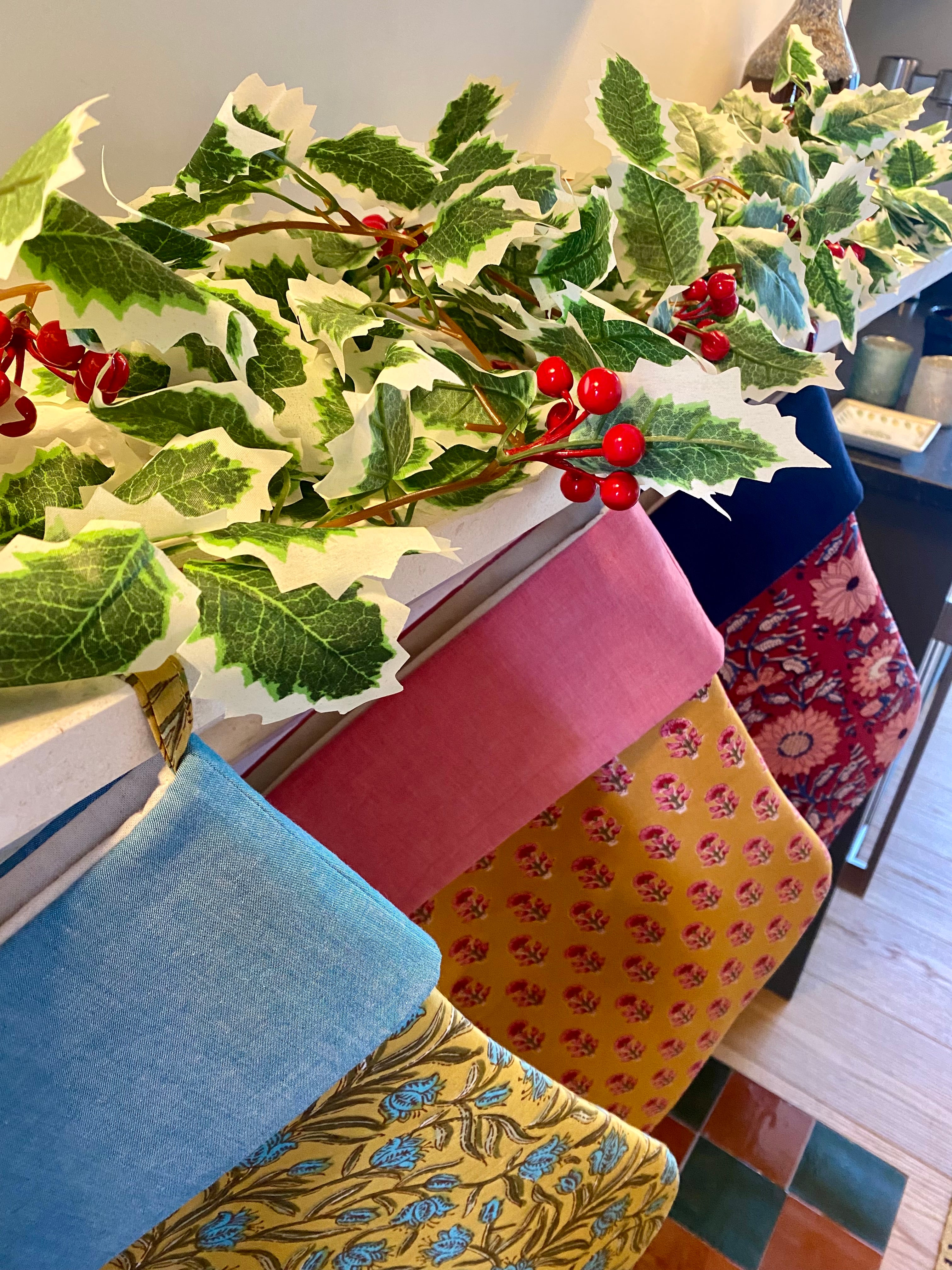 Colourful Christmas Stockings on a fireplace