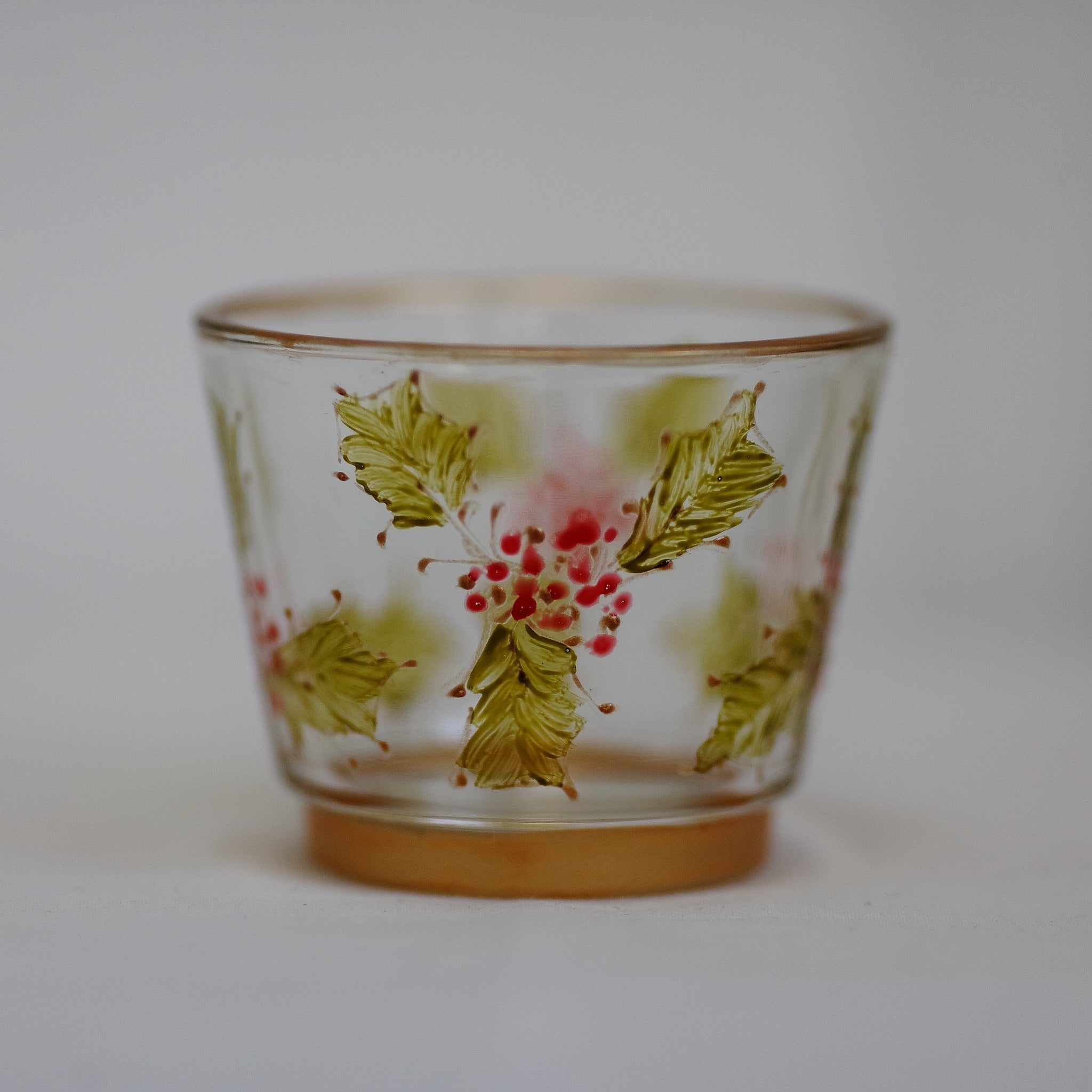 decorative tealight holder with hand painted berry and holly design