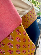 Indian blockprint christmas stockings handing on fireplace