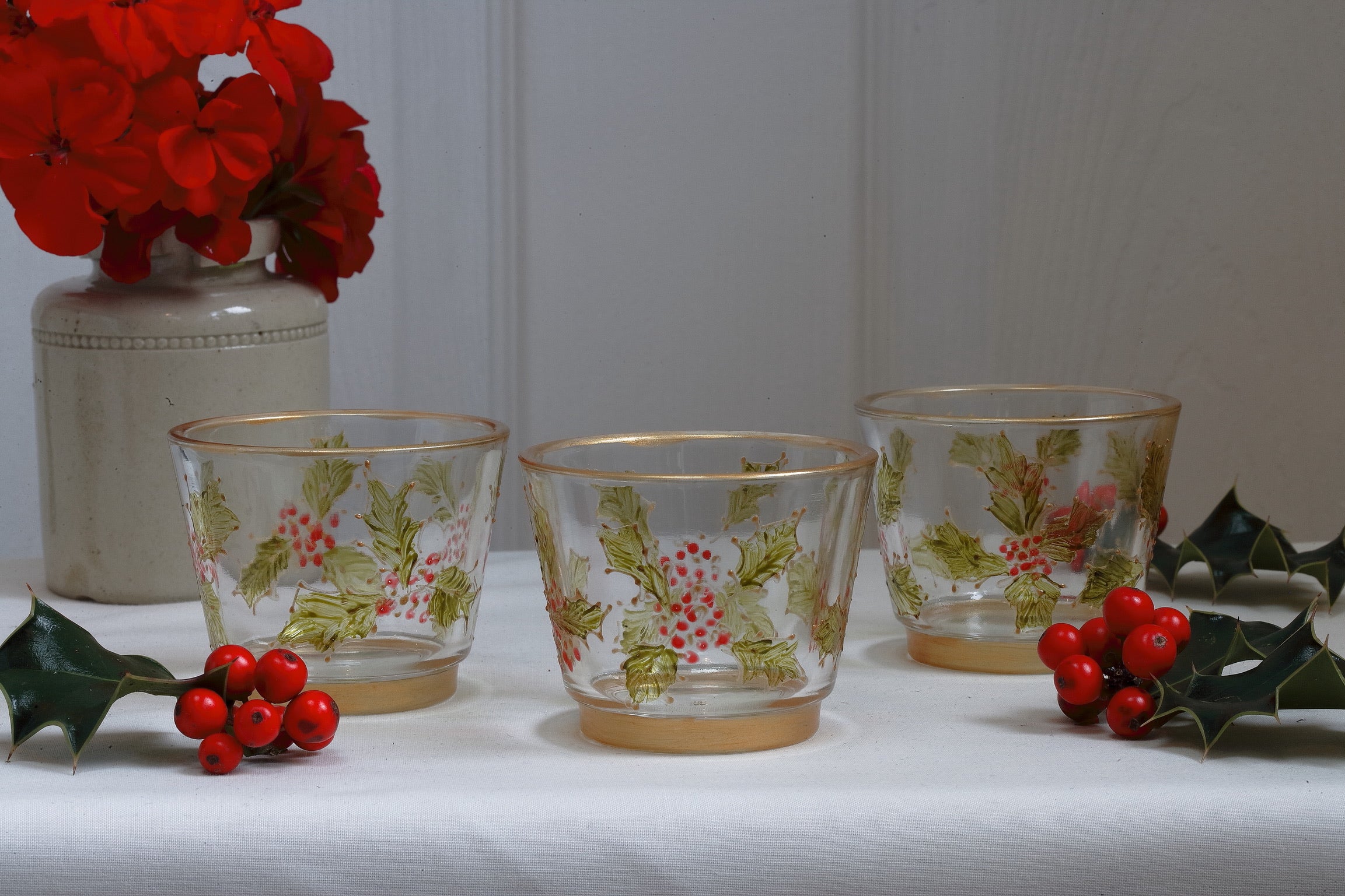decorative tealight holders with holly and berry pattern 