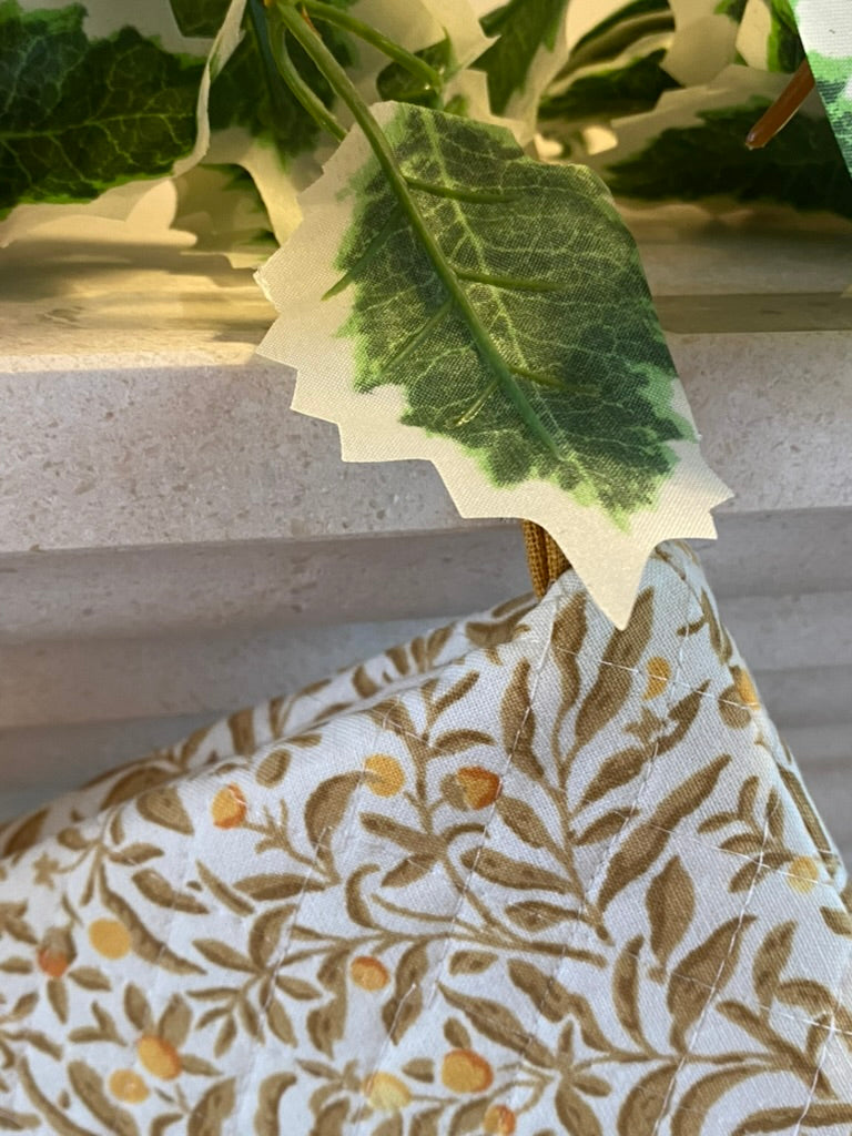 floral quilted stocking on a mantel